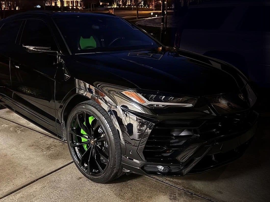 Jake's freshly detailed black Lamborghini Urus in a driveway at dusk.